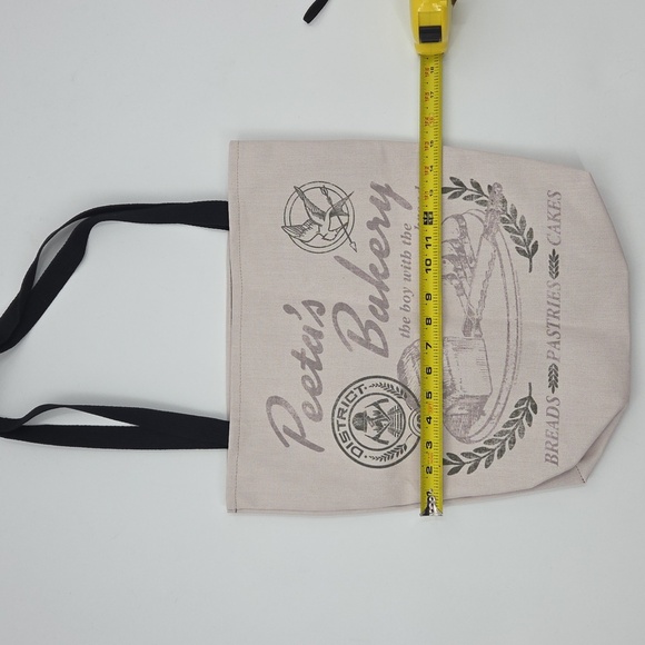 The Hunger Games Peeta's Bakery Cream Tote Bag - Picture 15 of 16
